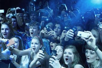 Why Live Nation Plunged Over 11% This Week: https://g.foolcdn.com/editorial/images/773586/fans-at-a-concert-screaming-enthusiastic-phones.jpg
