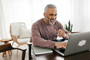 The Hidden Benefit of Claiming Social Security at Age 70: https://g.foolcdn.com/editorial/images/758702/older-man-smiling-laptop-gettyimages-1371116757.jpg