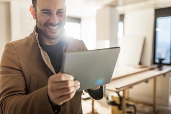 New to Investing? Here's Your First Investment in 2024.: https://g.foolcdn.com/editorial/images/756689/person-smiling-while-looking-at-a-tablet.jpg