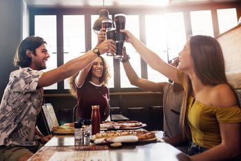 2 Unstoppable Dividend Stocks With High Yields: https://g.foolcdn.com/editorial/images/725499/people-sitting-in-a-restaurant-toasting-cola-glasses.jpg