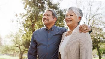 This Is the Maximum Social Security Benefit at 62 -- and Exactly How to Achieve It: https://g.foolcdn.com/editorial/images/761274/two-people-standing-outside-and-smiling.jpg