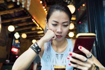 Why AT&T Stock Was a Market-Beater Today: https://g.foolcdn.com/editorial/images/790928/seated-young-person-gazing-at-a-smartphone.jpg