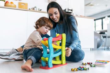 Everyone Is Talking About Mattel Stock. But This Top Toy Stock Is Beating It at Its Own Game.: https://g.foolcdn.com/editorial/images/741910/a-person-playing-with-her-son-with-toys.jpg