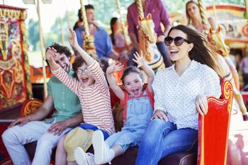 Is Disney a Buy Right Now?: https://g.foolcdn.com/editorial/images/745845/family-on-carousel-in-amusement-park-3.jpg