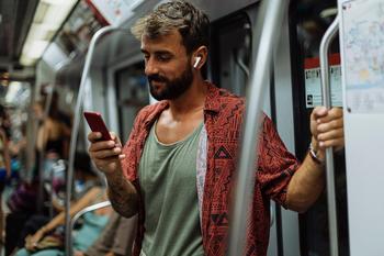 Why Apple Stock Was Up on Friday: https://g.foolcdn.com/editorial/images/719344/young-man-using-his-mobile-phone-while-riding-a-subway-train.jpg