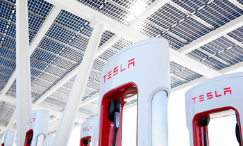 This "Magnificent Seven" Stock Has Tanked 7% in 2024: Is It Time to Buy the Dip?: https://g.foolcdn.com/editorial/images/785548/group-of-tesla-super-chargers-with-logo-in-view.png