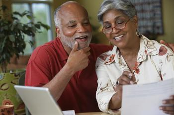 Here's How You Can Generate an Extra $10,000 in Dividends per Year in Retirement: https://g.foolcdn.com/editorial/images/778639/a-couple-reviewing-a-statement.jpg
