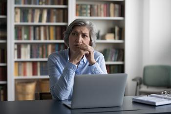 Filed for Social Security Too Early? Here's Why All Isn't Lost.: https://g.foolcdn.com/editorial/images/749696/older-woman-laptop-serious-gettyimages-1408920944.jpg