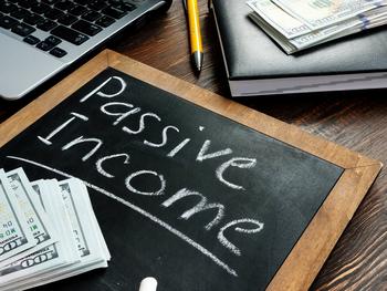 I'm Loading My Portfolio With These 3 No-Brainer Passive-Income Stocks: https://g.foolcdn.com/editorial/images/693609/a-small-chalk-board-with-passive-income-written-out-in-near-stacks-of-100-bills.jpg