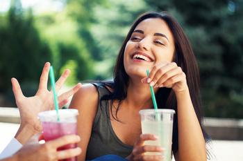 Got $5,000? Buy These 2 Stocks and Hold Until Retirement.: https://g.foolcdn.com/editorial/images/744512/young-woman-laughing-and-drinking-soda.jpg