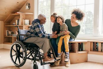 Is a Living Trust Really the Best Way to Pass an Inheritance to Your Family?: https://g.foolcdn.com/editorial/images/778598/aa-lady-wheelchair-family.jpg
