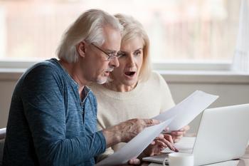 The Average American Age 65 and Older Has $232,710 Invested in a 401(k). 3 Strategies to Help You Beat the Average Before You Retire: https://g.foolcdn.com/editorial/images/766610/getty-images-older-couple-shocked-by-a-bill-gettyimages.jpg