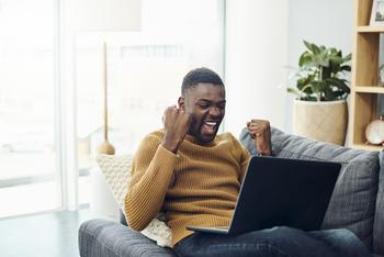 Apple Stock Has a Shot to Make History Today. Should Investors Be Excited or Worried?: https://g.foolcdn.com/editorial/images/738188/cheering-person-with-laptop.jpg