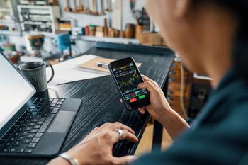 Why Investors Dimmed on Lumen Techologies Stock Today: https://g.foolcdn.com/editorial/images/746678/person-using-a-smartphone-while-seated-at-a-desk-with-a-laptop.jpg