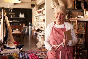 Earn $2,000 in Monthly Retirement Dividends With 3 Easy Steps: https://g.foolcdn.com/editorial/images/693635/senior-woman-wearing-apron-standing-next-to-shelves-of-apparel-in-a-store-small-business-owner-entrepreneur.jpg
