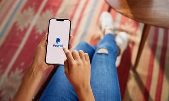 Is PayPal Stock a Buy?: https://g.foolcdn.com/editorial/images/781399/person-holding-phone-with-paypal-app-3_paypal.jpg