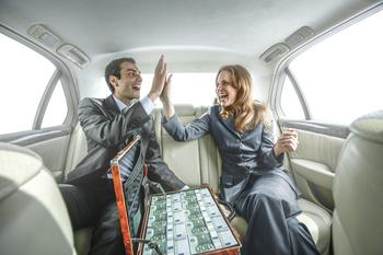 2 Millionaire-Maker Artificial Intelligence (AI) Stocks: https://g.foolcdn.com/editorial/images/767173/two-people-celebrating-with-cash-in-a-car.jpg
