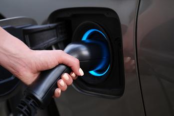 Why Canoo Stock Bumped Higher on Tuesday: https://g.foolcdn.com/editorial/images/746685/hand-holding-a-charger-plugged-into-an-electric-vehicle.jpg