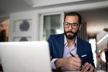 Social Security on Average Pays 40% of Workers' Earnings in Benefits, but What Will You Get?: https://g.foolcdn.com/editorial/images/773110/serious-person-staring-at-laptop-and-writing-note.jpg