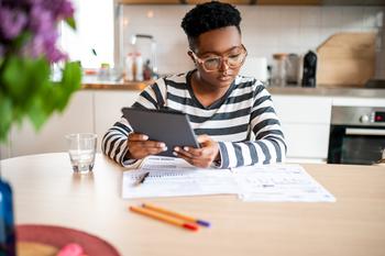 Doing These 3 Things Right Now Will Make Your Road to Retirement Much Smoother: https://g.foolcdn.com/editorial/images/699933/person-holding-tablet-and-looking-at-documents.jpg