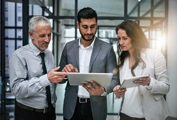 Cathie Wood Is Selling Her Favorite AI Stock, and Buying This Surprising Innovator Instead: https://g.foolcdn.com/editorial/images/759182/gettyimages-three-business-people-looking-at-tablets.jpeg