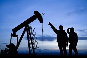 This Top Warren Buffett Stock Is Delivering Impressive Results: https://g.foolcdn.com/editorial/images/786725/the-silhouette-of-some-people-pointing-to-an-oil-well.jpg