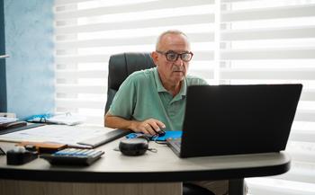 3 Ways to Make Healthcare Costs in Retirement More Manageable: https://g.foolcdn.com/editorial/images/770458/older-man-desk-serious-gettyimages-1418582589.jpg
