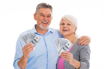 Turning 50 or More in 2024? It's Time to Catch Up on Retirement Planning.: https://g.foolcdn.com/editorial/images/759422/senior-couple-holding-cash-gettyimages-672432812.jpg