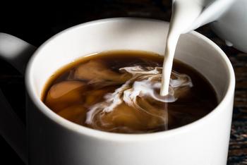 Why Investors Were Fired Up About Starbucks Stock Today: https://g.foolcdn.com/editorial/images/784007/white-liquid-being-poured-into-coffee.jpg