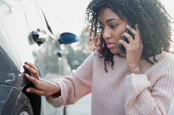 2 Top Insurance Stocks to Buy in August: https://g.foolcdn.com/editorial/images/742388/a-woman-on-the-phone-looking-at-damage-to-her-car-getty-2022.jpg