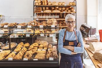 Going Back to Work as a Retiree? Here's Why You Might Regret It.: https://g.foolcdn.com/editorial/images/716381/senior-woman-working-a-smiling-person-wearing-an-apron-in-a-bakery_gettyimages-1283480932.jpg