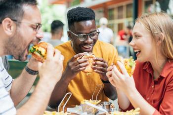 Better Stock to Buy: Coca-Cola vs. McDonald's: https://g.foolcdn.com/editorial/images/757027/friends-eating-burgers-and-fries-and-have-fun-in-outdoor-restaurant.jpg