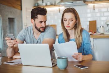 Prepare to Pay Your Student Loans Again: The Moratorium Is Nearly Over: https://g.foolcdn.com/editorial/images/734853/young-couple-looking-over-finances-at-home.jpg