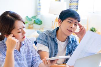 Can You Still Buy the Dow Jones' Best-Performing June Stocks?: https://g.foolcdn.com/editorial/images/738521/21_05_19-two-people-looking-at-paperwork-with-a-calculator-_gettyimages-1284647686.jpg