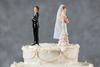 Could Getting Divorced Cost You Your Social Security Benefit?: https://g.foolcdn.com/editorial/images/771020/bride-and-groom-figurines-facing-away-from-each-other-on-top-of-wedding-cake-divorce-marriage-1318x880-a6f579b.jpg
