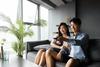 How to Invest In the Housing Market? Try This REIT: https://g.foolcdn.com/editorial/images/720126/young-couple-watching-tv-at-home.jpg