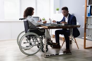 Want to Invest $1,000 in the "Magnificent Seven?" Invest This Amount in an S&P 500 Index Fund: https://g.foolcdn.com/editorial/images/762009/meeting-business-financial-planning-woman-wheelchair-disability-1200x800-5b2df79.jpg