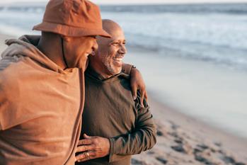 3 Lesser-Known Social Security Rules That Could Affect Your Benefits in Retirement: https://g.foolcdn.com/editorial/images/779464/two-people-smiling-hugging-on-the-beach.jpg