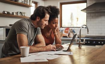 Why Bitcoin and Other Major Cryptos Were Surging Today: https://g.foolcdn.com/editorial/images/783512/two-people-gazing-at-a-laptop-screen-while-in-a-kitchen.jpg