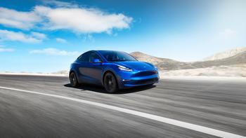 1 Unstoppable Stock With 990% Upside, According to Cathie Wood's Ark Invest: https://g.foolcdn.com/editorial/images/791345/a-blue-tesla-car-driving-on-an-open-road.jpg