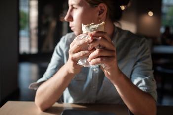 Stock Split Watch: Is Chipotle Next?: https://g.foolcdn.com/editorial/images/757128/customer-thinks-while-eating-burrito.jpg