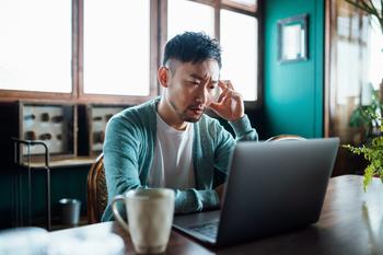 This Tax Rule Can Make Cashing Out Your 401(k) a Nightmare. Here's How to Avoid It.: https://g.foolcdn.com/editorial/images/770720/concerned-unhappy-person-staring-at-laptop.jpg