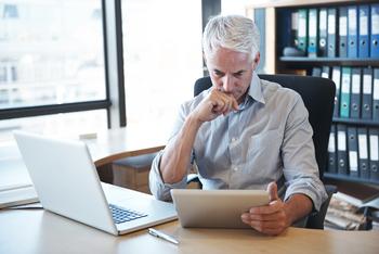 Don't Consider a Social Security Filing Without Answering These Questions First: https://g.foolcdn.com/editorial/images/747213/older-man-desk-tablet-serious-gettyimages-536316477.jpg