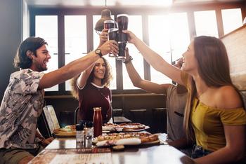 Should Income Investors Buy This Unstoppable Dividend King?: https://g.foolcdn.com/editorial/images/692210/a-group-of-people-toast-their-glasses-at-a-restaurant.jpg