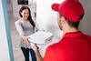 This Pizza Giant Is Taking a Risk With Uber Eats. Could It Pay Off for Investors?: https://g.foolcdn.com/editorial/images/753147/23_10_30-a-person-in-a-uniform-delivering-pizza-to-a-customer-_mf-dload.jpg