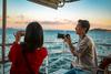 Booking Holdings Stock Is Up Almost 50% This Year. Can It Keep Flying Higher?: https://g.foolcdn.com/editorial/images/751336/couple-enjoys-sunset-cruise.jpg