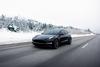 1 "Magnificent Seven" Stock With 1,234% Upside, According to Cathie Wood: https://g.foolcdn.com/editorial/images/774335/a-black-tesla-car-driving-on-an-open-road-in-the-snow.jpg