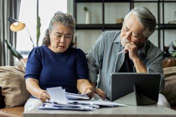 How Would Joe Biden and Donald Trump's Social Security Plans Affect Your Retirement Benefits?: https://g.foolcdn.com/editorial/images/769823/older-asian-couple-stressed.jpg