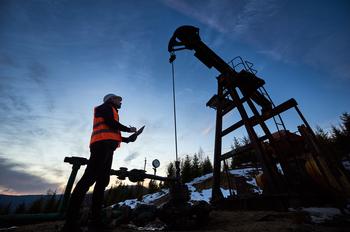 ExxonMobil Seals Its Megadeal for Pioneer Natural Resources. Time to Buy the Oil Giant?: https://g.foolcdn.com/editorial/images/750578/a-person-looking-up-at-an-oil-pump.jpg