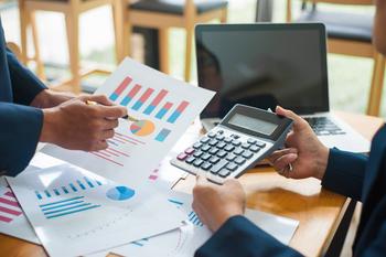 2 Asset Management Stocks That Are Passive Income All-Stars: https://g.foolcdn.com/editorial/images/692307/22_04_25-two-people-comparing-charts-with-a-calculator-and-computer-on-a-table-_gettyimages-1212963371.jpg